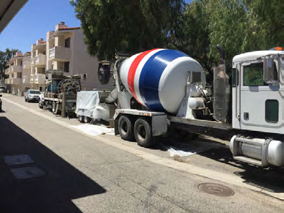 Ready-mix concrete truck delivering to a KIA Contractors placement site